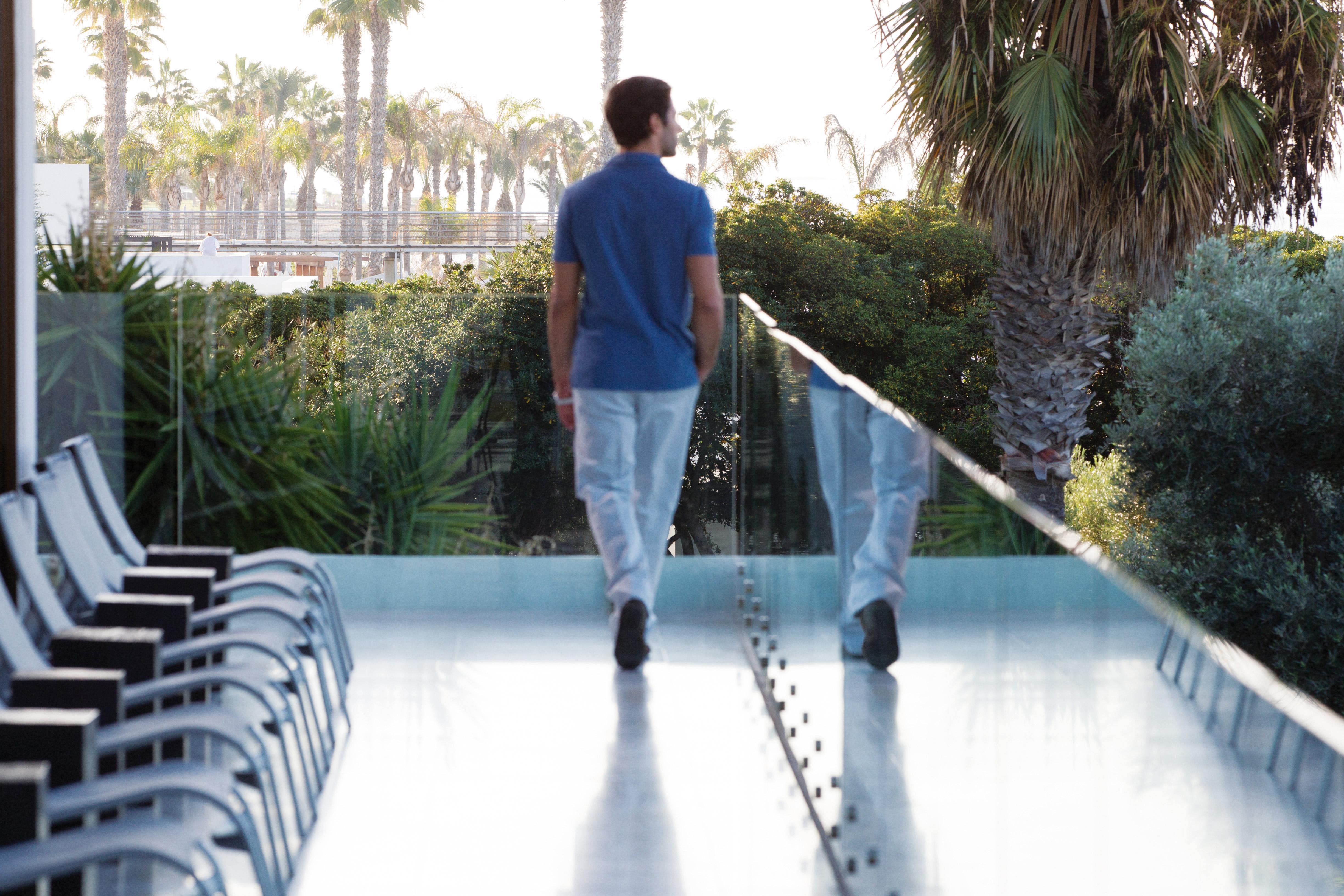 Almyra Hotel Paphos Exterior photo A man walking