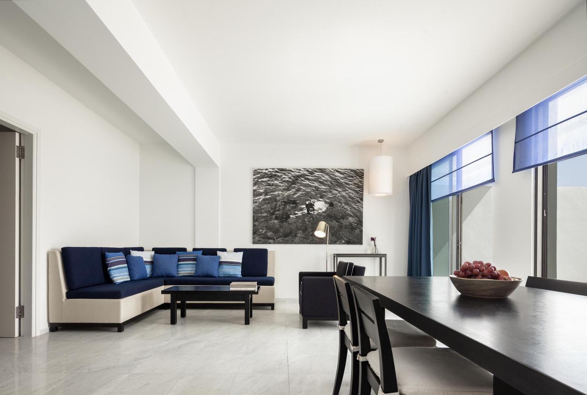 Almyra Hotel Paphos Exterior photo A living room in a suite at the hotel